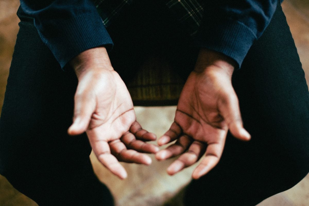 Person with hands palm up
